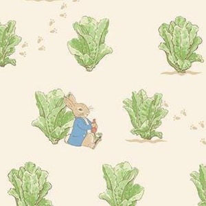 May include: A repeating pattern featuring a cartoon rabbit in a blue jacket, surrounded by green lettuce and small brown footprints on a cream background. The rabbit is holding a red object. The design is reminiscent of a children's book illustration.