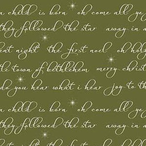 May include: Olive green fabric with white script text and star accents. The text includes phrases like "a child is born," "silent night," and "merry christmas." A festive, holiday-themed design.