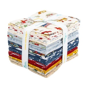 May include: A stack of fabric squares in various colors and patterns, tied with a white ribbon. The fabrics feature designs with patriotic themes, including flags and other Americana imagery. The ribbon reads "create colorfully".