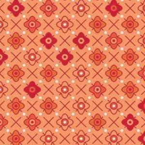 May include: A repeating pattern featuring stylized red and orange floral and cross designs on a peach background. The pattern includes small white dots and is suitable for fabric or wallpaper.