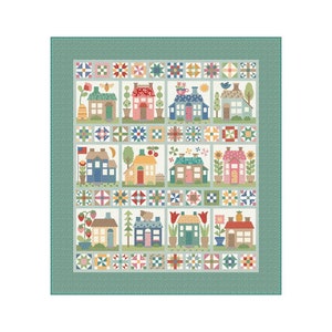 May include: A quilt featuring a patchwork design of colorful houses with various details, including flowers, birds, and windows. The houses are arranged in a grid pattern against a light blue background, surrounded by a green border.