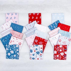 May include: A collection of rectangular fabric swatches arranged in three vertical stacks. The patterns include red, white, and blue floral prints, gingham checks, stripes, and star motifs. The fabrics feature a variety of color combinations.