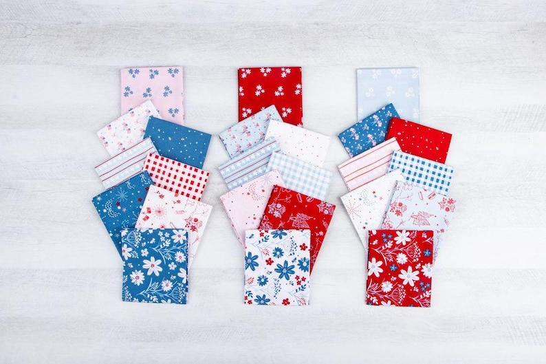 May include: A collection of rectangular fabric swatches arranged in three vertical stacks. The patterns include red, white, and blue floral prints, gingham checks, stripes, and star motifs. The fabrics feature a variety of color combinations.