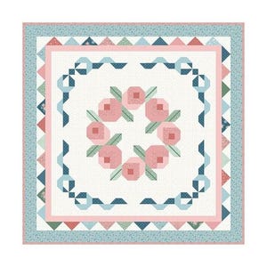 May include: A square quilt with a floral design. The quilt features a central wreath of pink flowers with green leaves, surrounded by a white background. The border includes pink, blue, and green geometric patterns.