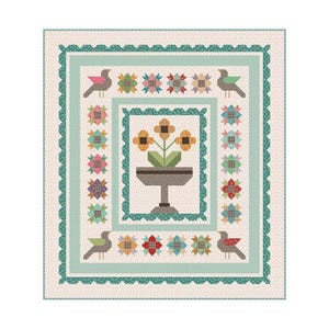 May include: A square quilt with a floral and bird design. The quilt features a central image of flowers in a pedestal planter, surrounded by decorative borders in shades of green, pink, and yellow. Birds are placed in each corner.