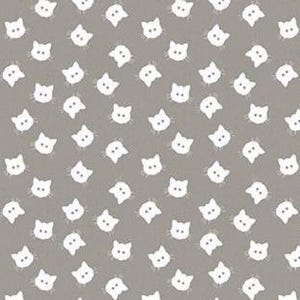 May include: A gray background is covered with a repeating pattern of white cat faces. The cat faces are simple, with two small ears, two eyes, and a small nose. The pattern is evenly spaced across the surface.