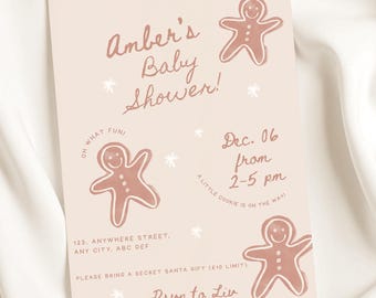 May include: A baby shower invitation with a pale pink background. The invitation features the text "Amber's Baby Shower!" and includes gingerbread man illustrations. Additional text includes the date, time, and location of the event.
