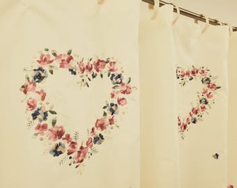 May include: White curtains with embroidered floral designs in shades of pink, blue, and green. The floral designs are arranged in a heart shape.