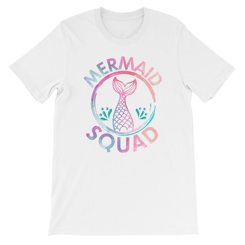 May include: White t-shirt with a watercolor-style graphic of a mermaid tail inside a circle with the text "Mermaid Squad".