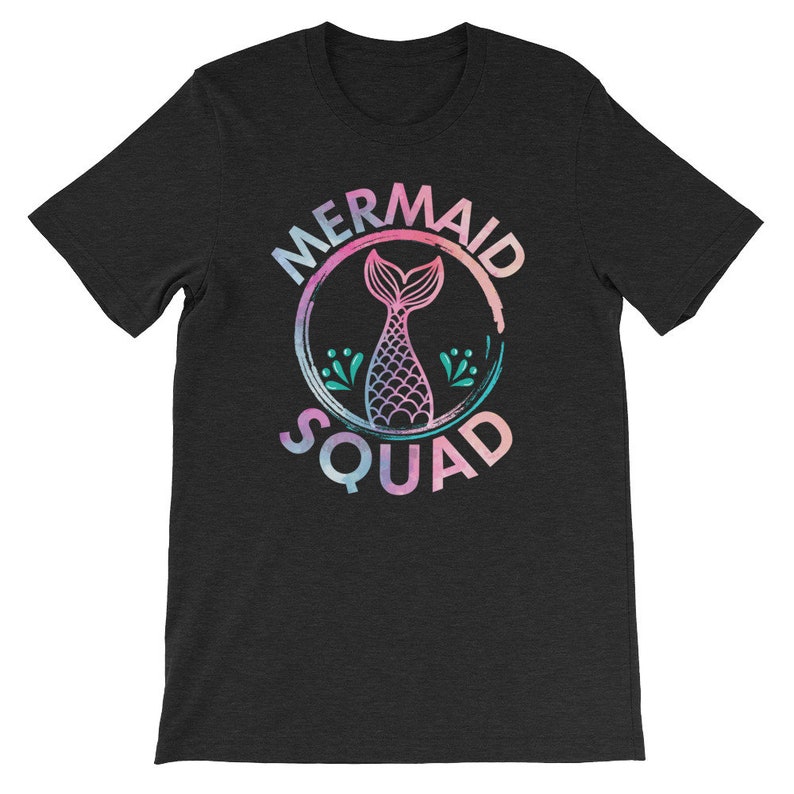May include: A black t-shirt with a watercolor-style graphic of a mermaid tail inside a circle. The text "Mermaid Squad" is written around the circle.