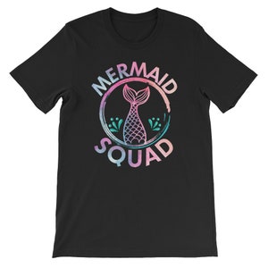 May include: Black t-shirt with a pink, blue, and green watercolor design of a mermaid tail inside a circle with the text "Mermaid Squad".