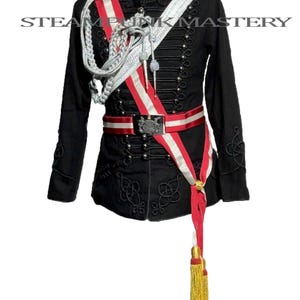 May include: Black military-style jacket with silver buttons, epaulets, and decorative embroidery. Features a red and white sash, a matching belt, and a gold tassel. The text "STEAM PUNK MASTERY" is visible on the jacket.