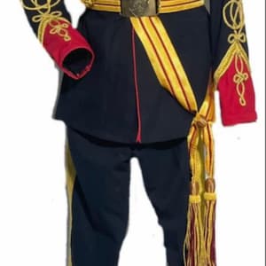 May include: A navy blue military-style uniform with gold and red trim. The uniform includes a jacket, pants, and a sash with gold and red braid. The jacket has a high collar and gold buttons. The pants have gold stripes down the sides. The sash is worn diagonally across the chest and has a gold tassel.