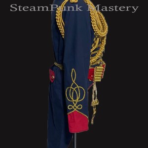 May include: A blue and red military-style jacket with gold trim and a gold braid accent. The jacket has a long tail and a stand-up collar.