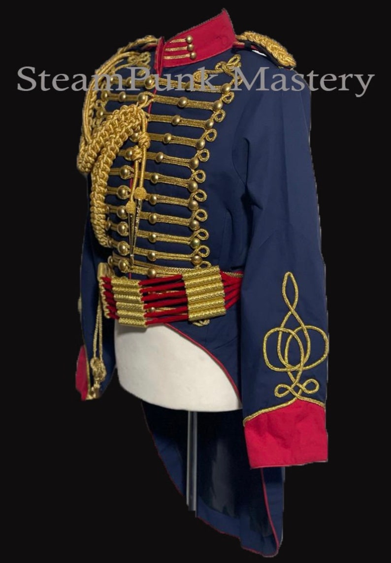 May include: A blue and red military-style jacket with gold trim and buttons. The jacket has a long tail and features a gold braid design on the sleeves. "SteamPunk Mastery" is written in white text on a black background.