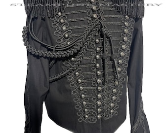 May include: A black military-style jacket with a high collar, intricate gold braid detailing, and silver buttons. The jacket has epaulets with black fringe and a braided rope accent.