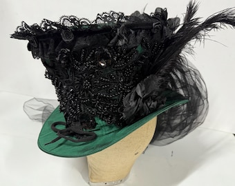 Wicked  green Top Hat black feathers and  Flowers