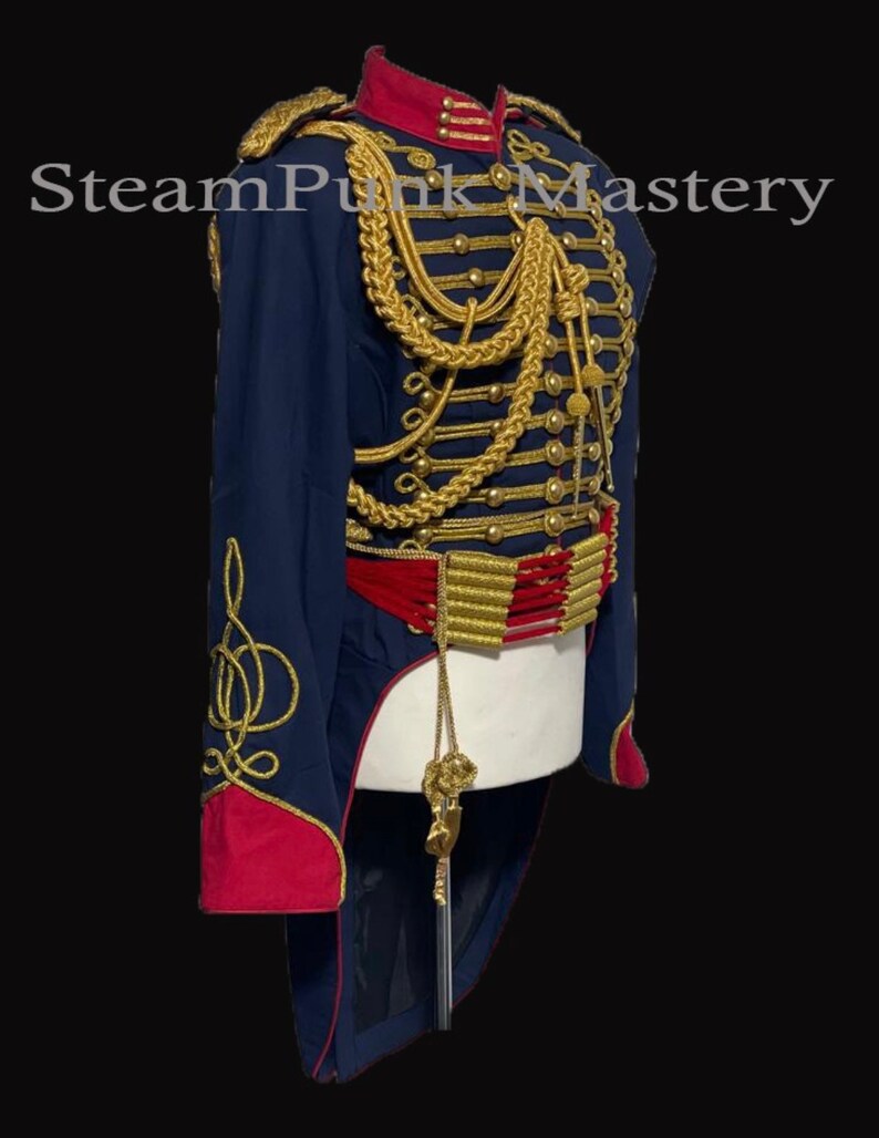 May include: A blue and red military-style jacket with gold trim and a long tail. The jacket has a high collar and a row of buttons down the front. The jacket is decorated with gold braid and tassels.