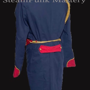 May include: A navy blue tailcoat with gold braid trim and red accents. The coat has a high collar and a long, flowing tail. The coat is fastened with a gold belt.