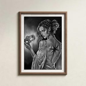May include: Black and white artwork of a person in a flowing gown holding a decorative mask. The person has a star tattoo on their back. The artwork is framed in a brown wooden frame.