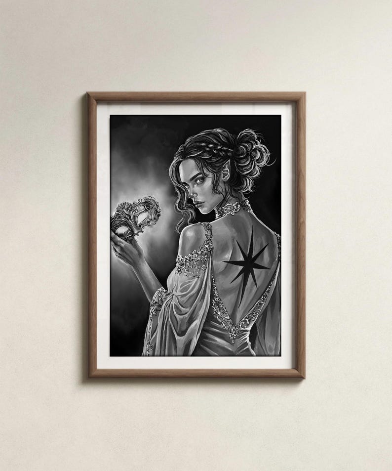 May include: Black and white artwork of a person in a flowing gown holding a decorative mask. The person has a star tattoo on their back. The artwork is framed in a brown wooden frame.