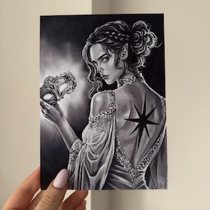 May include: Black and white illustration of a woman with pointed ears, wearing a gown and holding a mask. A star-shaped tattoo is visible on her back. The artwork has a fantasy theme.