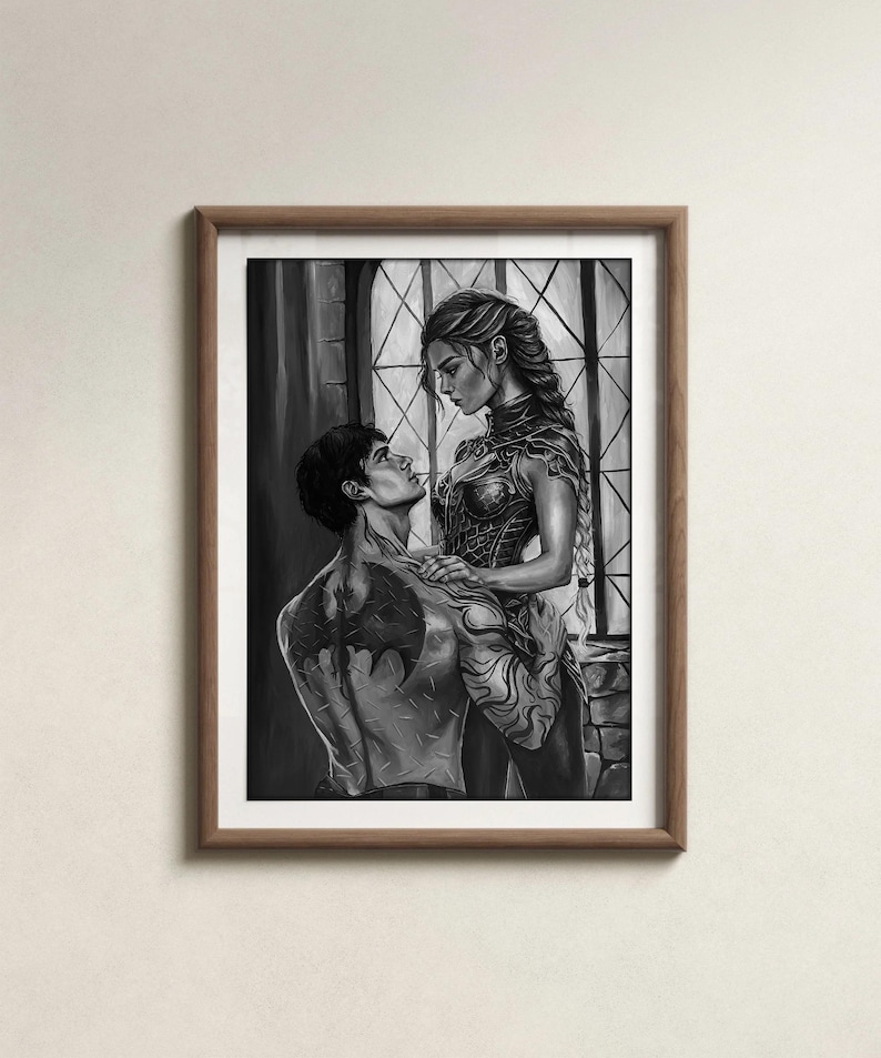 May include: Black and white framed artwork depicting two figures in a romantic embrace. The woman wears ornate armor, while the man has a tattoo on his back. The background features a window with a diamond pattern.