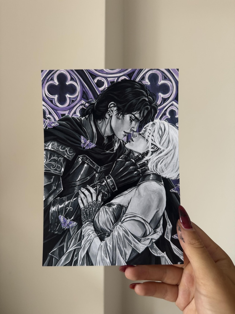 May include: A rectangular art print featuring a black and white illustration of two figures in an intimate embrace. One figure wears dark armor and a cape, while the other has short white hair. Purple butterflies and a gothic arch background.