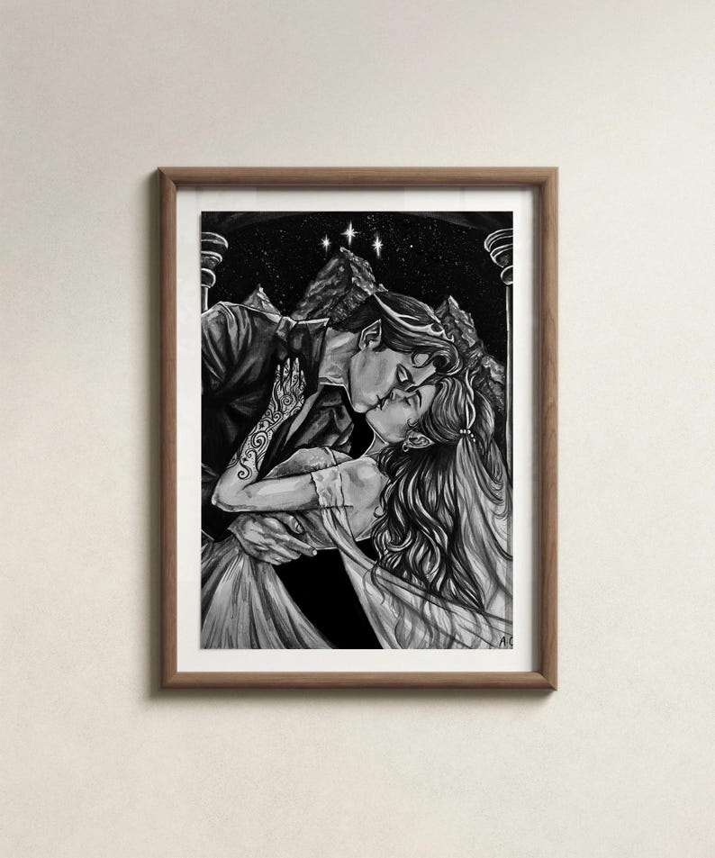 May include: Monochrome framed art print showing a couple kissing. The image features a man and woman in an embrace, with a backdrop of a starry sky and mountains. The artwork is detailed, focusing on the figures' expressions and attire.