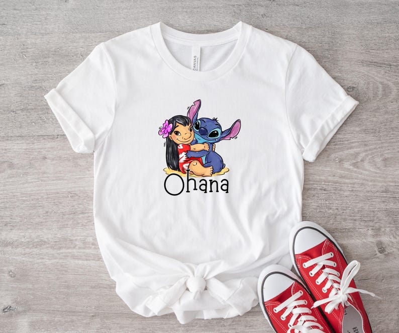 May include: White t-shirt with a graphic of Stitch and Lilo hugging. The text "Ohana" is printed below the image.