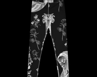 Puede incluir: Leggings negros con estampado floral blanco con rosas y una figura religiosa. El estampado incluye una mujer con una corona y un hombre con barba.