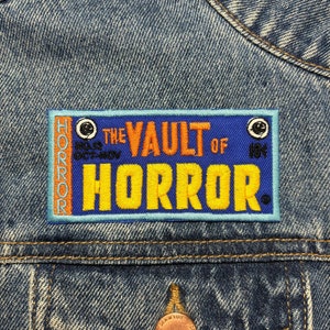 Broderad lapp med Vault Comic-motiv. Skräckfilmsinspirerade lappar. Stryk-på-baksidan.