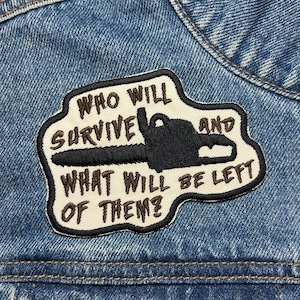 May include: A white patch with black stitching on a blue denim jacket. The patch features a chainsaw and the text "Who will survive and what will be left of them?"