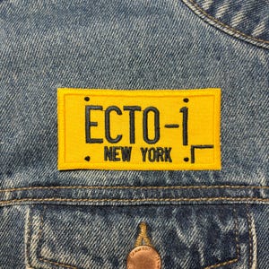 May include: Yellow and black embroidered patch with the text "ECTO-1. NEW YORK."