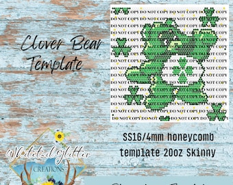 May include: A green clover bear rhinestone template for a 20oz skinny tumbler. The template is for 4mm honeycomb rhinestones and is labeled "SS16/4mm honeycomb template 20oz Skinny Rhinestone Template".