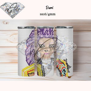 May include: Three stainless steel tumblers with a mosaic design featuring a person with purple hair and a colourful patterned outfit. The tumblers have the text "Rumi" and "SS16/4mm". The background is a light wood.