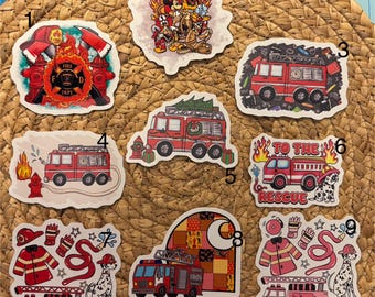 May include: A collection of colorful stickers featuring fire trucks, Dalmatian dogs, and fire department-related imagery. Designs include a fire hydrant, flames, and the text "To The Rescue".
