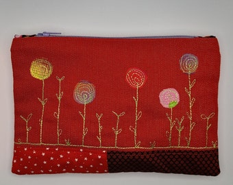 Fabric applique and free machine embroidery stitched zippy purse