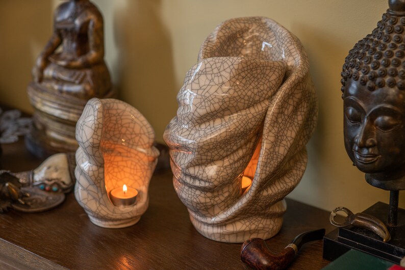 Handmade adult urn for cremation ashes Light. The urn has a place for a candle in the middle or an option for putting flowers. The capacity of 237 cubic inches. Ashes go inside the walls. This is a photo of a large urn and keepsake.
