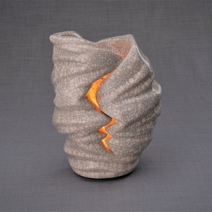 Handmade Adult Urn for Cremation ashes. The urn has a place for a candle in the middle, or option for putting flowers. Adult size urn with capacity of 237 cubic inches. Ashes go inside the walls. The color of this handmade ceramic urn is craquelure.