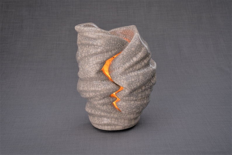 Handmade Adult Urn for Cremation ashes. The urn has a place for a candle in the middle, or option for putting flowers. Adult size urn with capacity of 237 cubic inches. Ashes go inside the walls. The color of this handmade ceramic urn is craquelure.