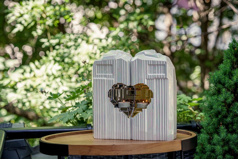 Companion urn set of two high-quality ceramic cremation urns for ashes. This companion urn (double urn) consists of two identical Heart urns, which placed together form a large heart.  Designed and made by Pulvis Art Urns. Available in many colors.