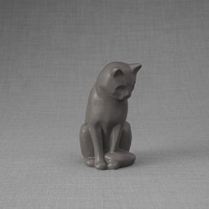 Ceramic Art Urn for Cats cremation ashes. The urn represents a cat sitting in a comfortable position with its tail around her body and its head gently looking left. Mini pet memorial urn. Pet memorial urn for ashes. Pet mini urn. Mini Urn by Pulvis