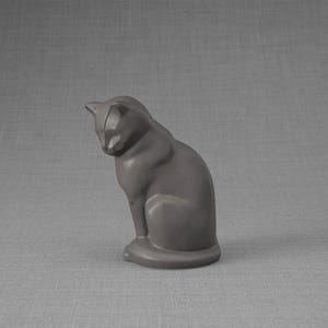 Ceramic Art Urn for Cats cremation ashes. The urn represents a cat sitting in a comfortable position with its tail around her body and its head gently looking left. Mini pet memorial urn. Pet memorial urn for ashes. Pet mini urn. Mini Urn by Pulvis