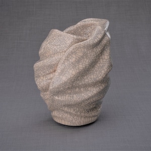 Handmade Adult Urn for Cremation ashes. The urn has a place for a candle in the middle, or option for putting flowers. Adult size urn with capacity of 237 cubic inches. Ashes go inside the walls. The color of this handmade ceramic urn is craquelure.