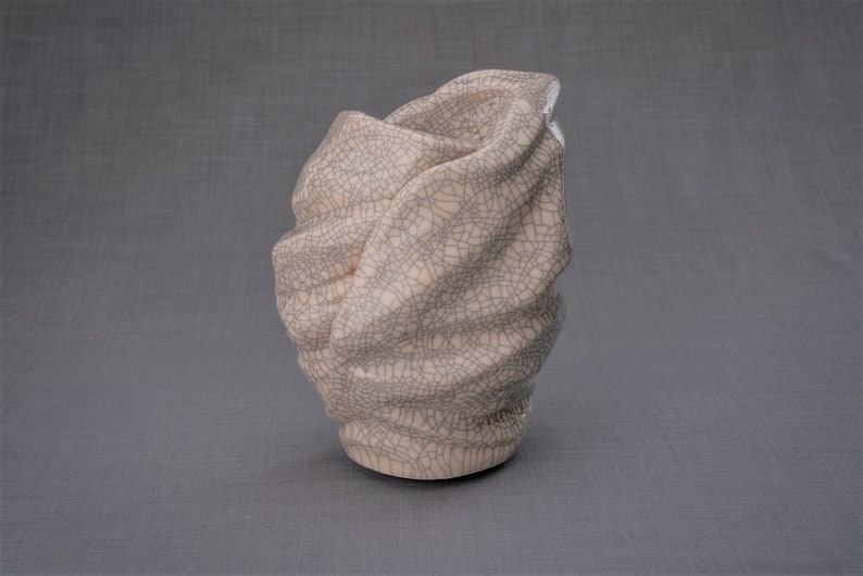 Handmade Adult Urn for Cremation ashes. The urn has a place for a candle in the middle, or option for putting flowers. Adult size urn with capacity of 237 cubic inches. Ashes go inside the walls. The color of this handmade ceramic urn is craquelure.