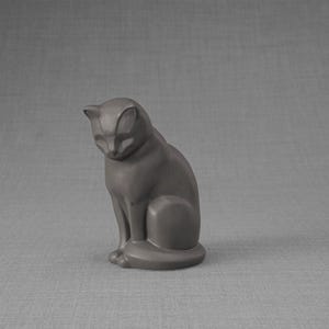 Ceramic Art Urn for Cats cremation ashes. The urn represents a cat sitting in a comfortable position with its tail around her body and its head gently looking left. Mini pet memorial urn. Pet memorial urn for ashes. Pet mini urn. Mini Urn by Pulvis