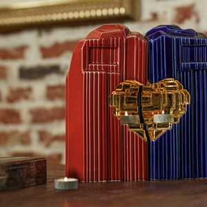 Companion urn set of two high-quality ceramic cremation urns for ashes. This companion urn (double urn) consists of two identical Heart urns, which placed together form a large heart.  Designed and made by Pulvis Art Urns. Available in many colors.