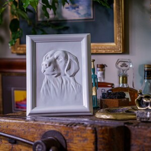 Labrador Retriever Pet Urn for Ashes. This beautiful picture frame portrait urn of a labrador retriever is a unique memorial for a lab dog. Handmade from ceramic, this pet urn for labrador is the ideal resting place for a loved friend. By Pulvis Art