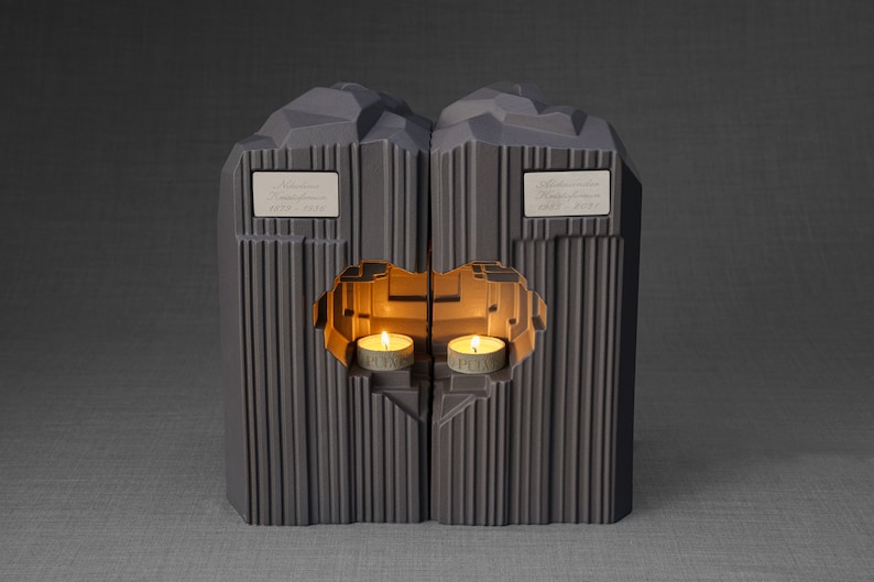Companion urn set of two high-quality ceramic cremation urns for ashes. This companion urn (double urn) consists of two identical Heart urns, which placed together form a large heart.  Designed and made by Pulvis Art Urns. Available in many colors.